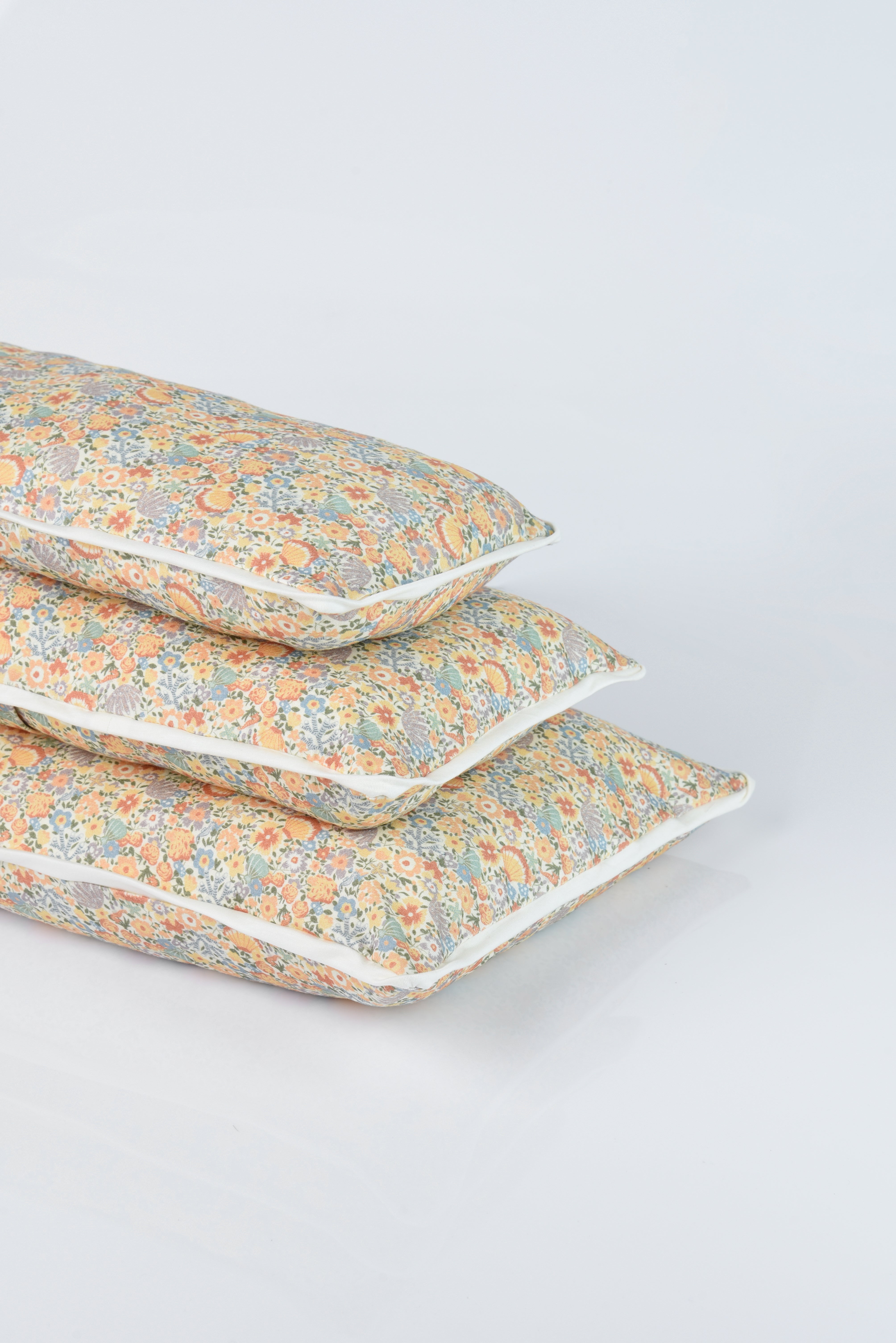 Petite Cuddle Pillow in Coralino
